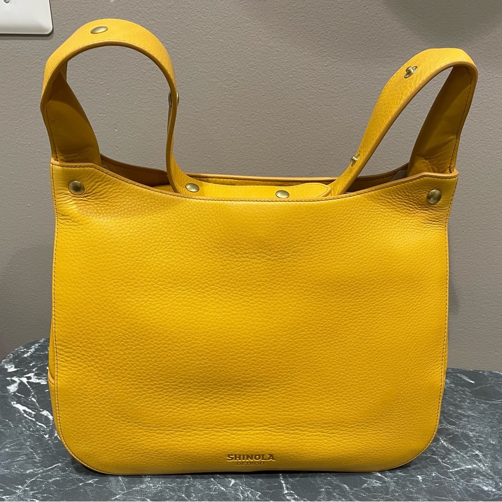 Shinola over shoulder bag with extendable strap. New in bag never been used.